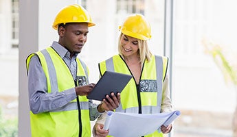 a man and woman discussing a construction project