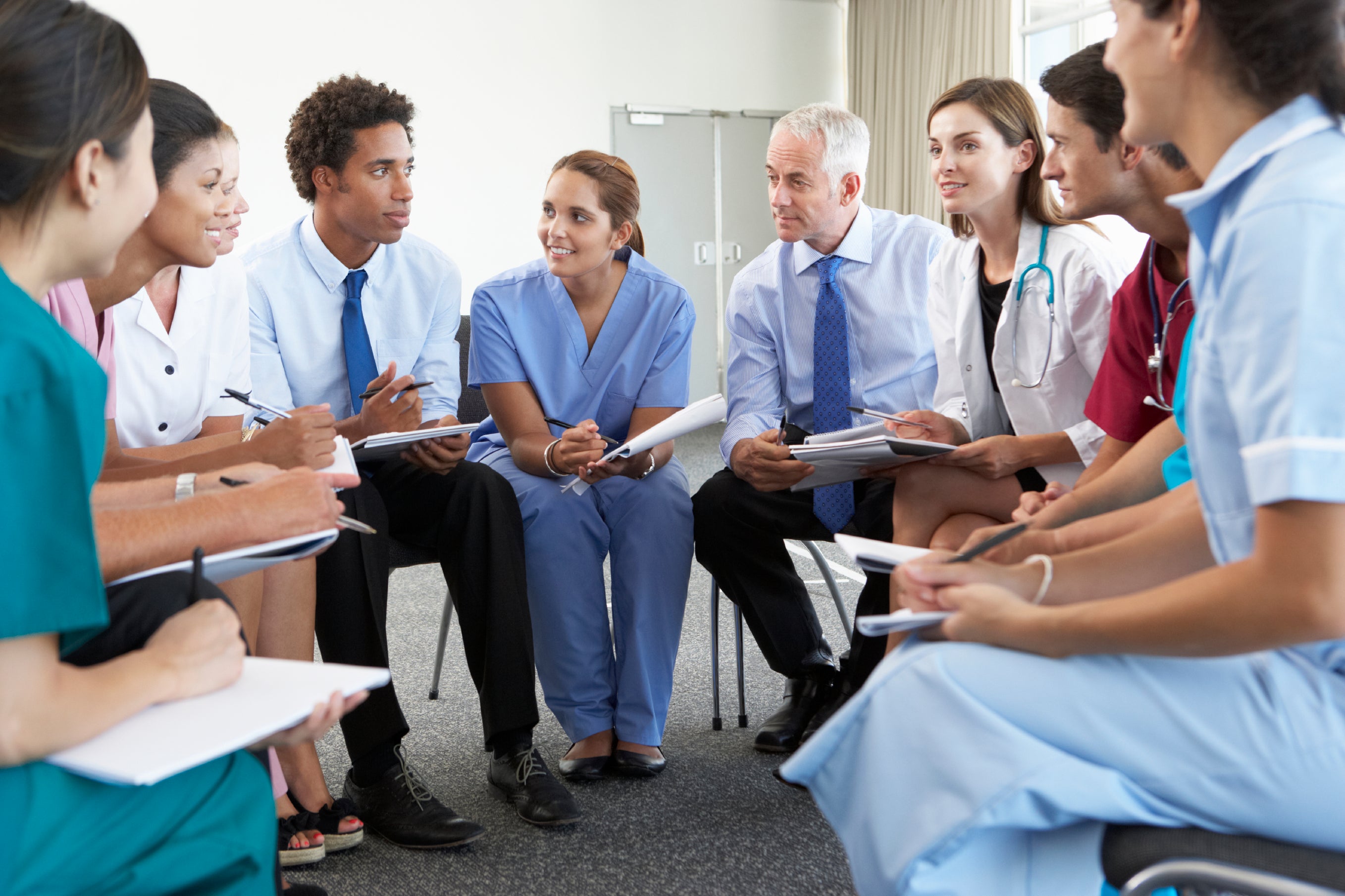 Diverse hospital staff gathered together