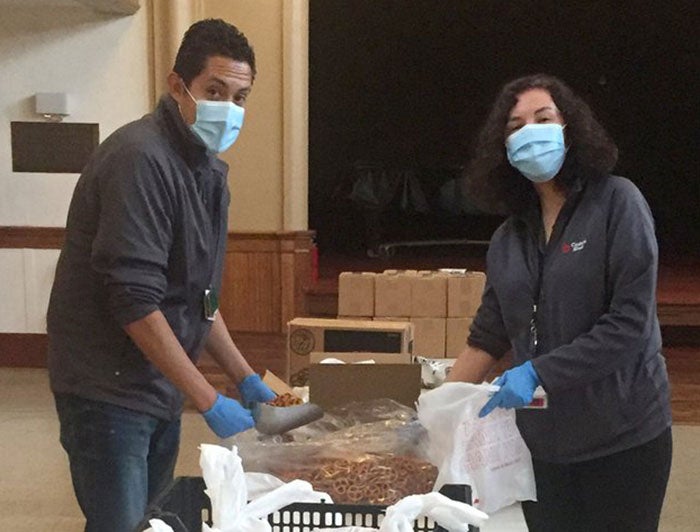 Two people packing food