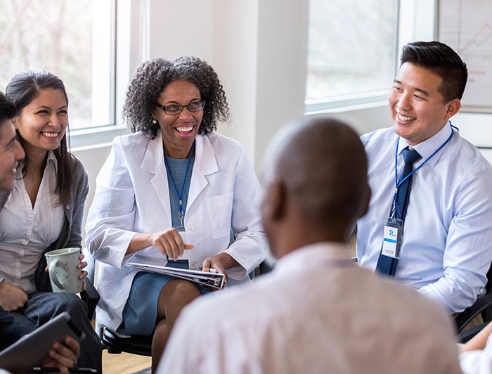 cheerful medical colleagues in meeting