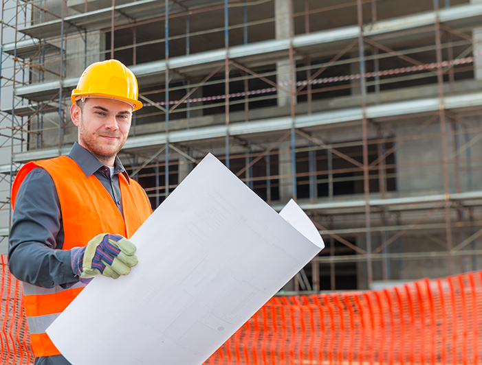 CHC exam review man on construction site with hard hat smiling confidently