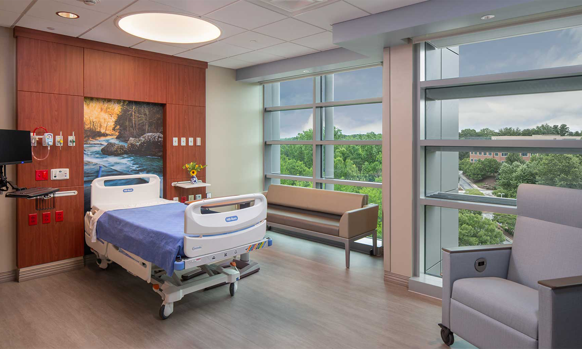 Patient rooms include floor-to-ceiling windows for added natural light, patient-controlled lighting, and enhancements to support patient safety and wellbeing.