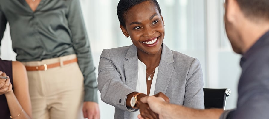 Handshake around a table