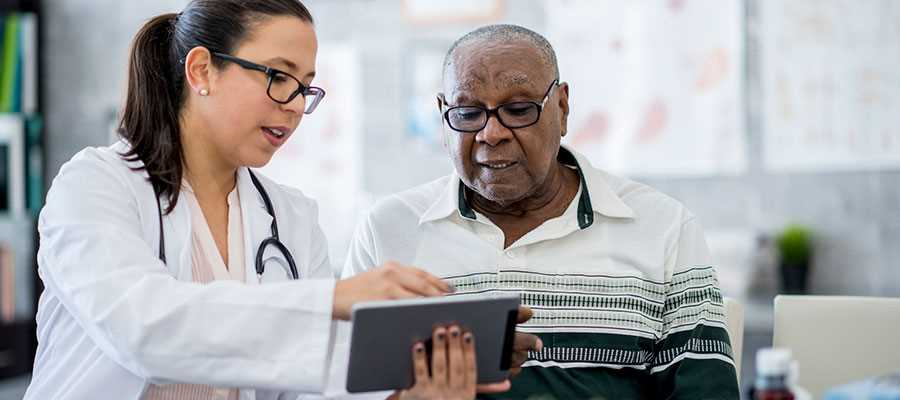 Nurse with patient and tablet