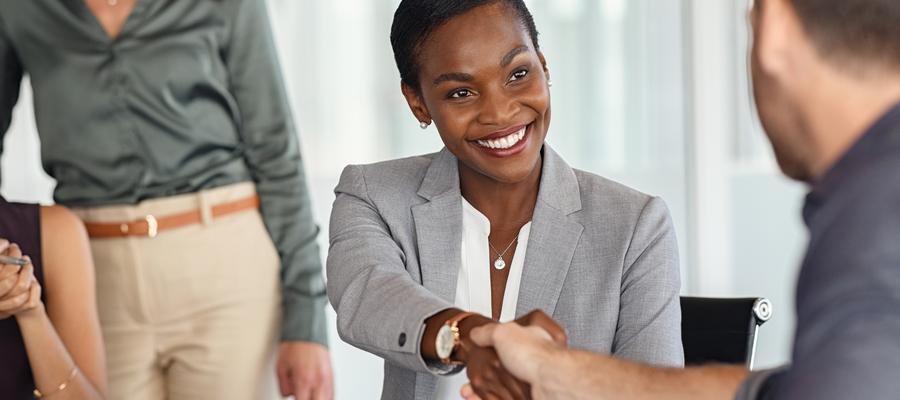 Handshake around a table