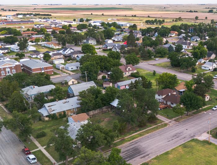 Aerial view of a residential area amidst rural land